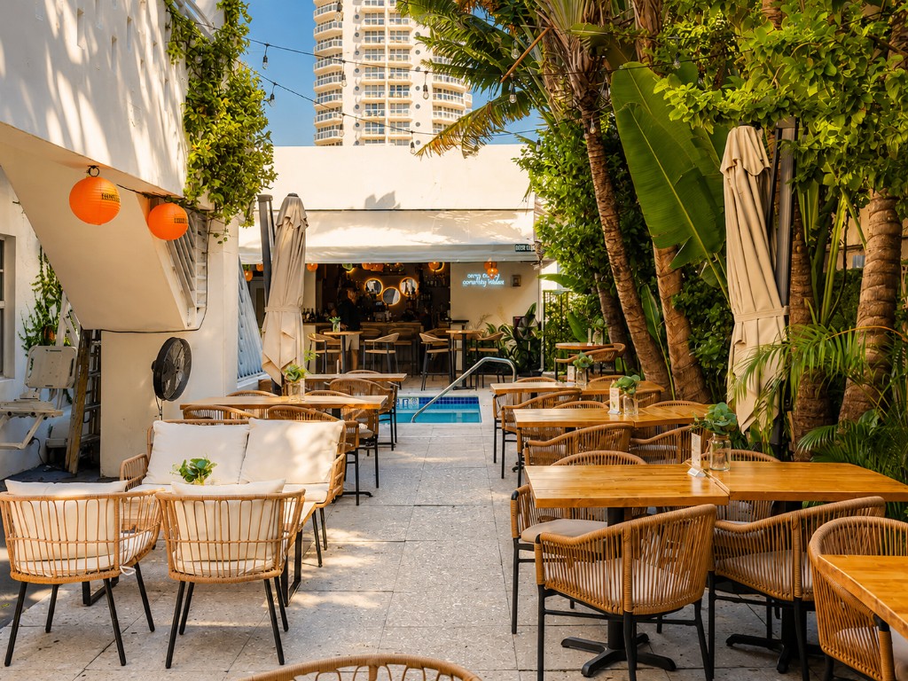 The Lemon Branch Hotel courtyard seating and tropical landscaping on Harding Avenue, Miami Beach